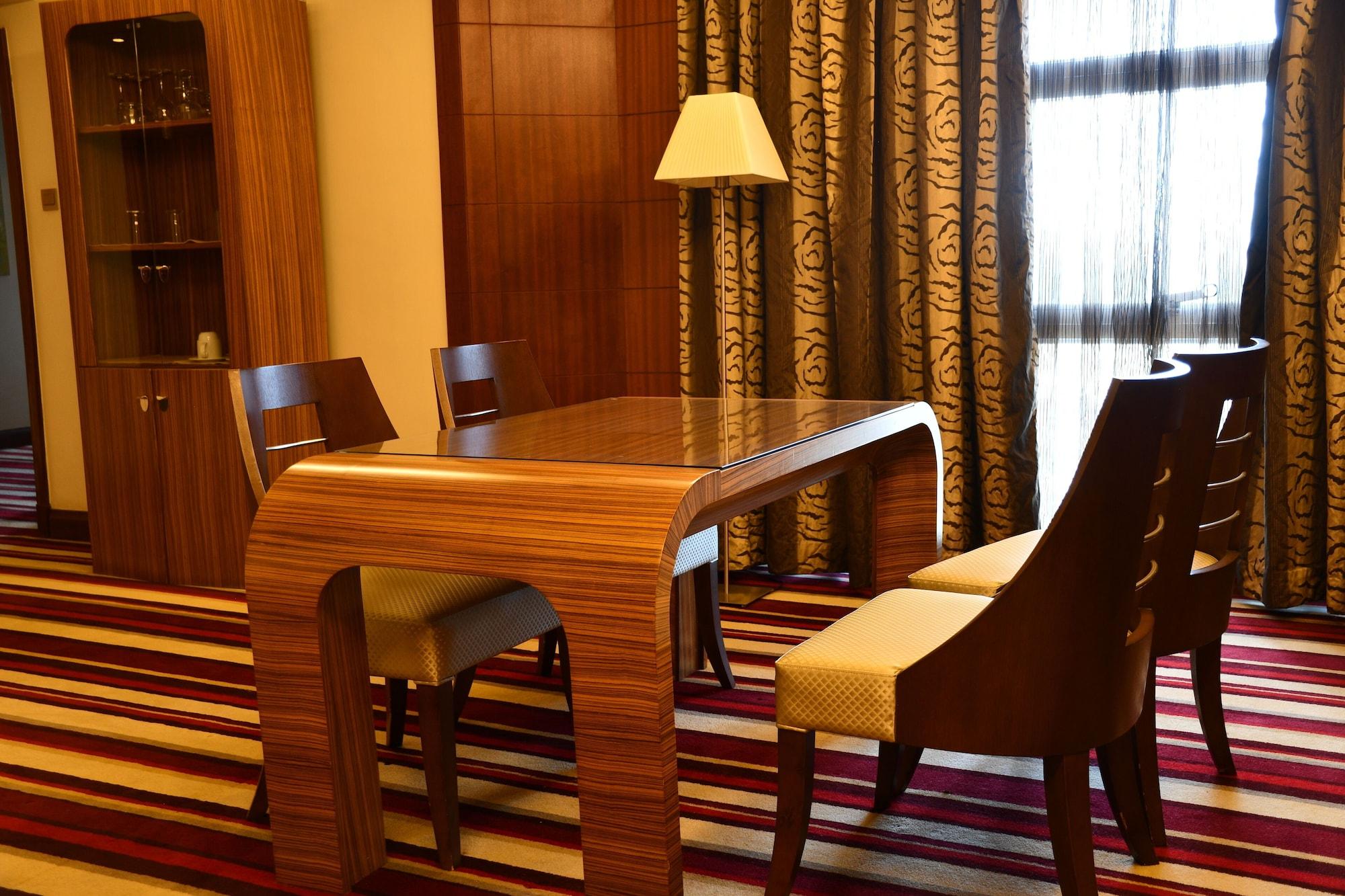 The Boma Nairobi Hotel Exterior photo A table and chairs